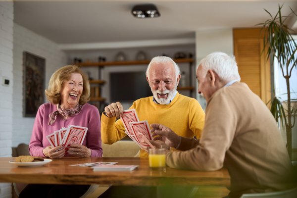 senior-communities-senior-friends-playing-cards-home-1